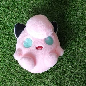 Pink Plush Toy with Black and Green Accents